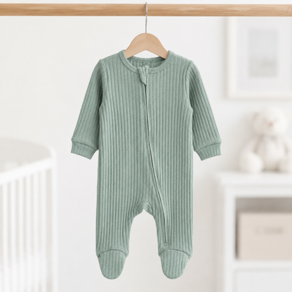 A soft ribbed baby sleepsuit in a beautiful muted sage green shade.