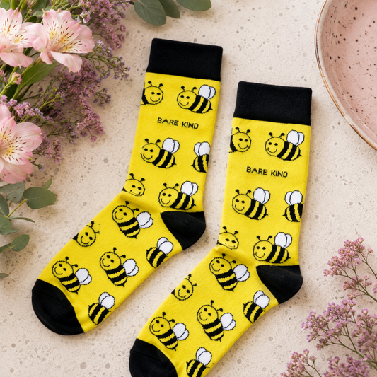 Bare Kind yellow bamboo bee socks with black cuffs and bee print