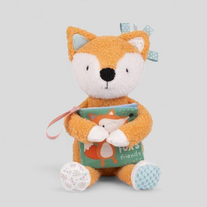 Plush sensory fox toy holding a book 