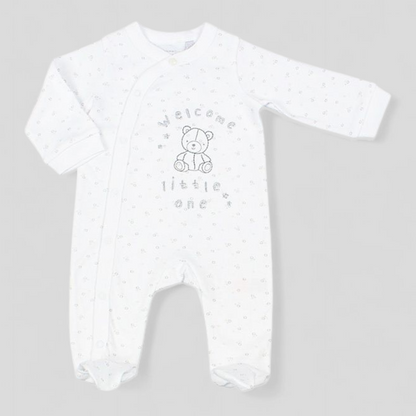 White baby sleepsuit with star pattern and embroidered Welcome little one and teddy bear 