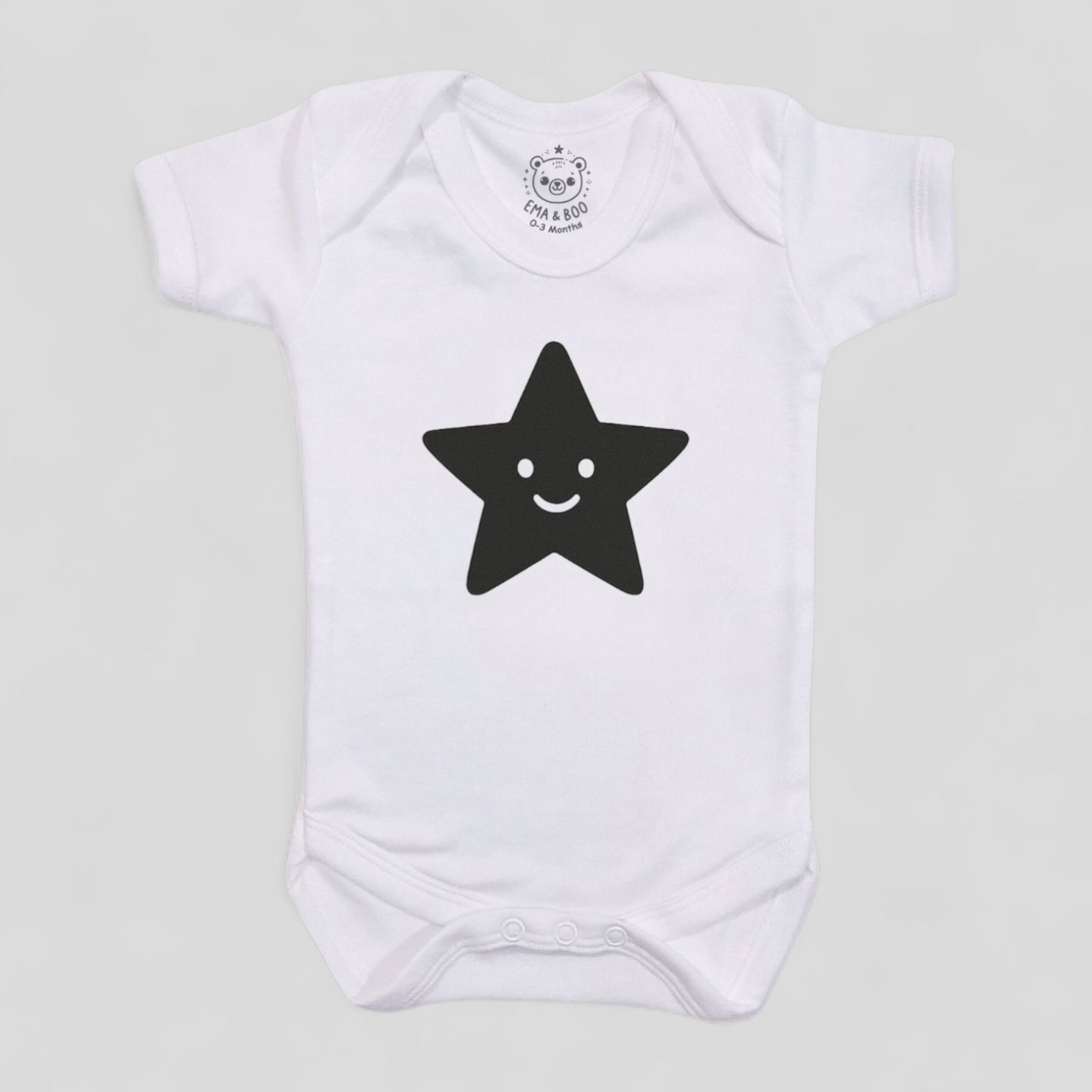 White baby bodysuit with black star – unisex MonoCub monochrome babywear.