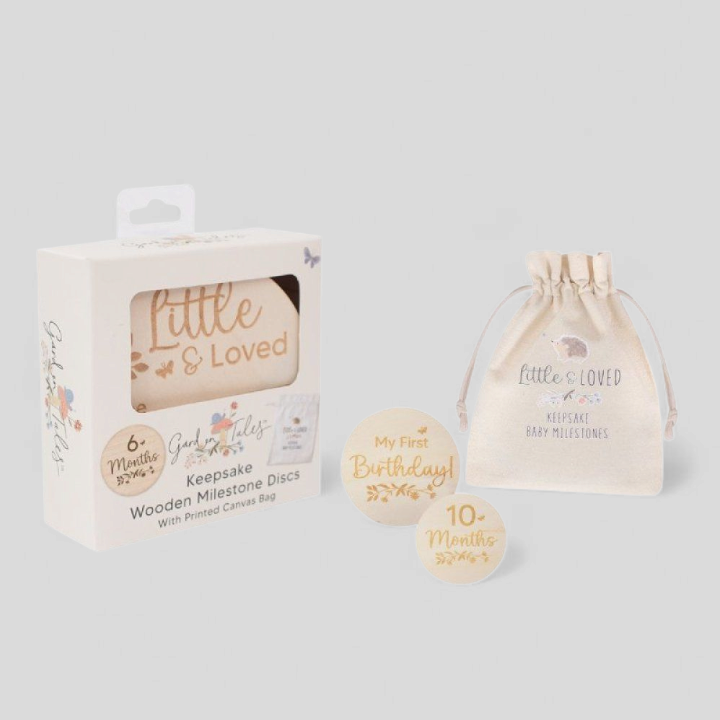 Packaging of Little & Loved wooden milestone discs with a drawstring bag
