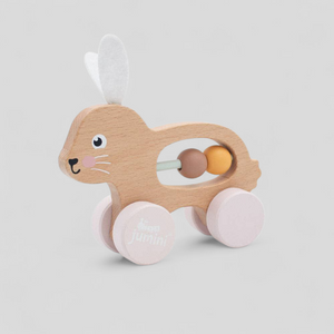 Wooden toy with pink wheels and a smiling face, push along bunny