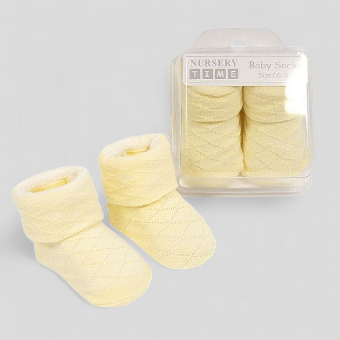 Yellow newborn baby socks with diamond design in gift box