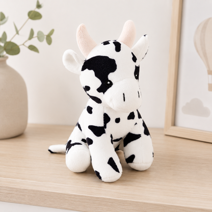 Soft black and white plush cow toy for babies